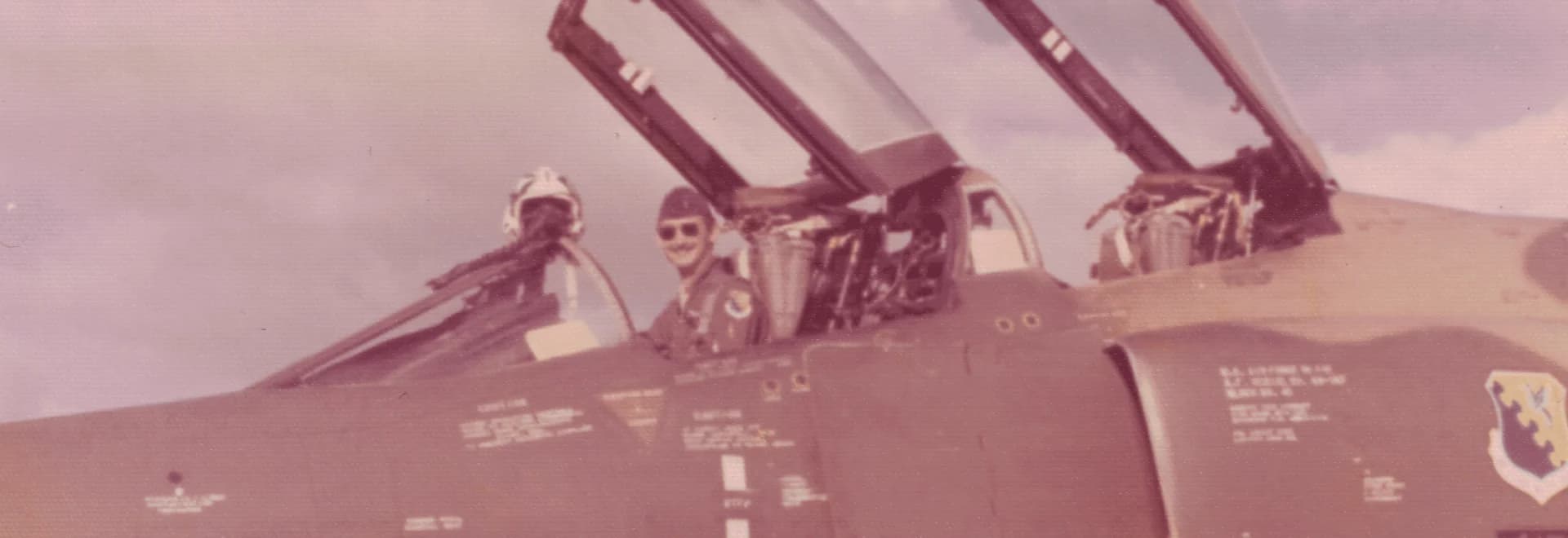 Captain Sid Lorio seated in an F-4E Phantom II cockpit