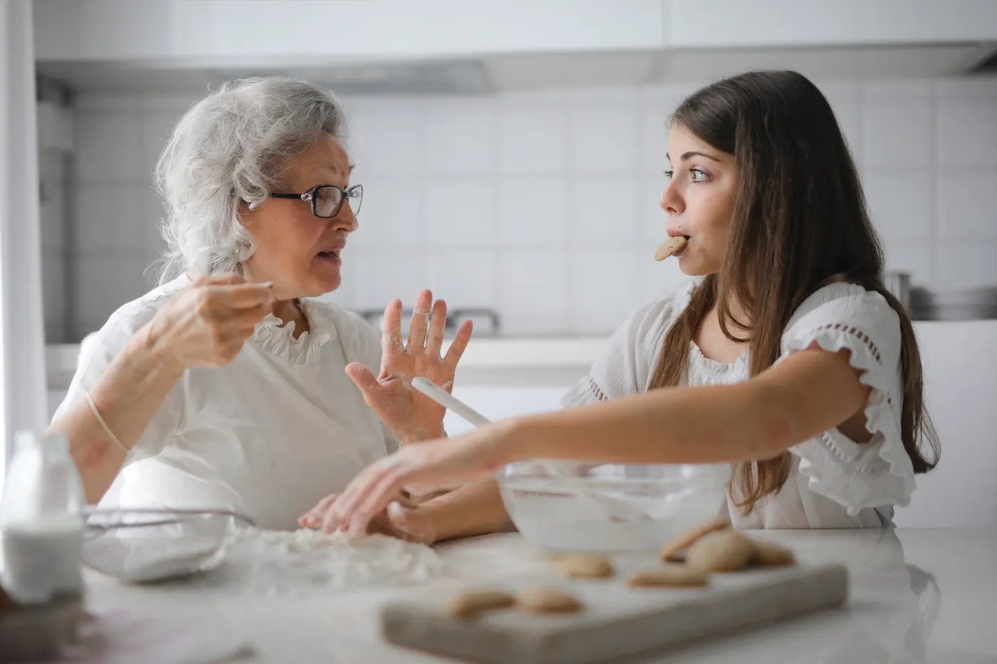Greta and Haley baking together in a family kitchen